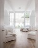 Modern home with Bedroom, Light Hardwood Floor, Bed, Recessed Lighting, Ceiling Lighting, and Chair. The master bedroom oasis furnished with Gervasoni furniture by Paola Navone. Photo 7 of Beautiful Belgian-inspired Farmhouse