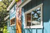 Modern home with Exterior, House Building Type, Beach House Building Type, A-Frame RoofLine, Curved RoofLine, Cabin Building Type, Wood Siding Material, Shed Building Type, and Metal Roof Material. Artistic accents to draw your eye Photo 3 of Paradise Tiny Home