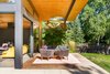 Modern home with Outdoor, Wood Patio, Porch, Deck, Trees, Shrubs, Decking Patio, Porch, Deck, and Small Patio, Porch, Deck. "Passive cooling became another key sustainable strategy—an evaporative cooler was used in lieu of air conditioning, which works well with the open plan and desire to keep doors open," says the firm. "This uses significantly less energy than air conditioning and works well in the dry climate of Colorado." Photo 3 of Boulder Retreat