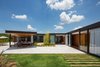 Modern home with Outdoor, Side Yard, Landscape Lighting, Walkways, Gardens, Grass, Stone Patio, Porch, Deck, Trees, Wood Patio, Porch, Deck, and Flowers. bedrooms patio Photo 5 of Pindaibeiras House