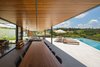 Modern home with Outdoor, Gardens, Back Yard, Hanging Lighting, Swimming Pools, Tubs, Shower, Trees, Stone Patio, Porch, Deck, Shrubs, Infinity Pools, Tubs, Shower, and Large Pools, Tubs, Shower. veranda and pool Photo 6 of Pindaibeiras House
