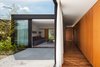 Modern home with Outdoor, Wood Patio, Porch, Deck, Large Patio, Porch, Deck, Stone Patio, Porch, Deck, Trees, Side Yard, and Gardens. bedrooms corridor and tv room Photo 11 of Pindaibeiras House