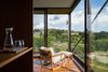 Modern home with Chair and Dark Hardwood Floor. master bedroom balcony Photo 13 of Pindaibeiras House