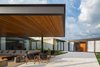 Modern home with Exterior, Flat RoofLine, Metal Roof Material, Wood Siding Material, Glass Siding Material, House Building Type, and Metal Siding Material. exterior lounge Photo 15 of Pindaibeiras House