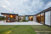 Modern home with Exterior, Glass Siding Material, Metal Siding Material, House Building Type, Metal Roof Material, Flat RoofLine, and Wood Siding Material. exterior lounge with light Photo 20 of Pindaibeiras House