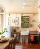 Modern home with Kitchen, Table Lighting, Medium Hardwood Floor, Drop In Sink, Refrigerator, Ceiling Lighting, and Range Hood. The kitchen with Viking oven and original cypress floors exposed. Photo 2 of Antoine Bordeaux House