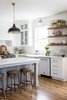 Modern home with Kitchen, Drop In Sink, Wall Oven, Pendant Lighting, and Dishwasher. Classic, chic and sophisticated — the open kitchen features Big Chill's Classic Dishwasher in White with Brushed Brass trim and Big Chill's 36" Classic Stove in Custom Basalt Gray with Brushed Brass trim. Photo 3 of Stunning Kitchen Renovation by House of Jade
