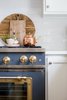 Modern home with Kitchen and Wall Oven. Details are essential to making the spaces a success, and the brushed brass trim on Big Chill's 36" Classic Stove in Custom Basalt Gray takes the appliance game to the next level. Photo 8 of Stunning Kitchen Renovation by House of Jade