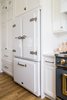 Modern home with Kitchen, Refrigerator, and White Cabinet. Not to be mistaken for cabinetry, Big Chill's Classic Fridge in White with Satin Nickel trim adds an extra element of luxury to the kitchen. Photo 9 of Stunning Kitchen Renovation by House of Jade