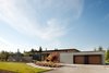 Modern home with Exterior, House Building Type, Metal Roof Material, Flat RoofLine, Farmhouse Building Type, Concrete Siding Material, Stone Siding Material, and Wood Siding Material. Olympia Prairie Home exterior Photo of Olympia Prairie Home