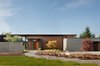 Modern home with Exterior, Flat RoofLine, Wood Siding Material, Concrete Siding Material, Metal Roof Material, House Building Type, Stone Siding Material, and Farmhouse Building Type. Olympia Prairie Home exterior Photo 2 of Olympia Prairie Home