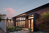 Modern home with Exterior, House Building Type, Farmhouse Building Type, Concrete Siding Material, Stone Siding Material, Flat RoofLine, Wood Siding Material, and Metal Roof Material. Olympia Prairie Home exterior Photo 12 of Olympia Prairie Home