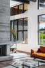 Modern home with Living Room, Sofa, Medium Hardwood Floor, Coffee Tables, and Wood Burning Fireplace. Living Room Fireplace Details Photo 7 of Vancouver Island Residence