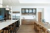 Modern home with Kitchen, Refrigerator, Undermount Sink, Wood Cabinet, Medium Hardwood Floor, Pendant Lighting, and Engineered Quartz Counter. Kitchen Photo 17 of Vancouver Island Residence