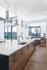 Modern home with Kitchen, Pendant Lighting, Wood Cabinet, Medium Hardwood Floor, Engineered Quartz Counter, and Undermount Sink. Kitchen & Breakfast Nook Photo 18 of Vancouver Island Residence