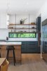 Modern home with Kitchen, Ceramic Tile Backsplashe, Colorful Cabinet, Wall Oven, Refrigerator, Wood Cabinet, Medium Hardwood Floor, Engineered Quartz Counter, and Pendant Lighting. Kitchen Photo 19 of Vancouver Island Residence