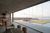 Modern home with Outdoor, Front Yard, Concrete Fences, Wall, Desert, Decking Patio, Porch, Deck, Large Patio, Porch, Deck, and Large Pools, Tubs, Shower. The terrace is communicated with the rest of the house and it has a mobile glass wall that allows the family to use the space all year around. Photo 11 of Pi House