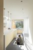 Modern home with Kitchen, Quartzite Counter, Wine Cooler, Concrete Floor, Wood Cabinet, Stone Tile Backsplashe, Drop In Sink, Recessed Lighting, and Pendant Lighting. Wine cellar Photo 3 of The Nook House