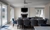 Modern home with Living Room, Sofa, Ceiling Lighting, Standard Layout Fireplace, Sectional, Light Hardwood Floor, and Recessed Lighting. Living Space Photo 3 of The Southold House
