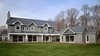 Modern home with Exterior, House Building Type, Stone Siding Material, Shingles Roof Material, A-Frame RoofLine, and Vinyl Siding Material. Exterior showcasing triple glazed custom European windows Photo 6 of The Southold House