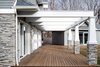 Patio with custom stone work and pergola Photo 11 of The Southold House modern home