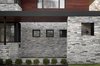 Modern home with Windows, Metal, and Picture Window Type. Side View of Front Entrance Photo 3 of The Manhasset House