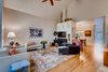 Modern home with Living Room and Wood Burning Fireplace. Living Room with original wood burning fireplace Photo 6 of Harrison Townhomes By Arquitectonica