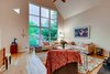 Modern home with Living Room and Light Hardwood Floor. Living Room with wall of glass Photo 4 of Harrison Townhomes By Arquitectonica