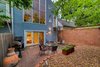 Modern home with Shingles Roof Material, Sawtooth RoofLine, House Building Type, and Stucco Siding Material. Rear yard Photo 3 of Harrison Townhomes By Arquitectonica