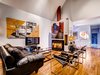 Modern home with Living Room, Track Lighting, and Chair. Neighboring Unit at 266 Harrison with original color scheme i.e. white, yellow, black marble Photo 11 of Harrison Townhomes By Arquitectonica