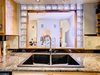 Modern home with Kitchen and Drop In Sink. Glass Block Kitchen Detail 266 Harrison Street Photo 13 of Harrison Townhomes By Arquitectonica