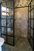 Modern home with Ceramic Tile Floor. For this bathroom we designed the shower doors and built them on site. Photo 12 of Casa Brumas