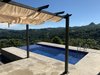 Modern home with Outdoor, Trees, Small Patio, Porch, Deck, Side Yard, Small Pools, Tubs, Shower, Landscape Lighting, and Infinity Pools, Tubs, Shower. 1. View from the Pool Deck & Pergola area down to the Reventazon River valley landscape Photo 2 of Mountain House GetAway