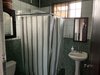 15. Light main bathroom tiled with green and while marble ceramic Photo 16 of Mountain House GetAway modern home