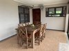 6. Dining area with all set for feeding the family or entertaining guests Photo 7 of Mountain House GetAway modern home