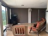 8. The large windows, looking over the surrounding stunning landscape, are equipped with pull-down shades control the amount of sunlight allowed in as some windows are bound to receive direct sunlight at some point throughout the course of the day Photo 9 of Mountain House GetAway modern home