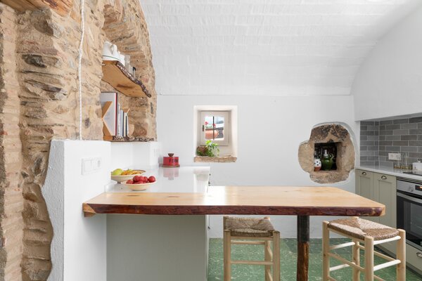 The kitchen was the first room to be modernised and revealed some surprises, including the arched stone wall. 