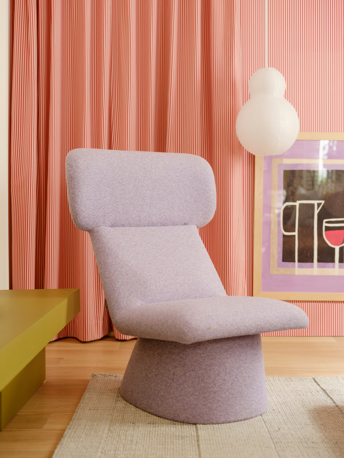 A purple Sancal chair sits regally in the living room. 