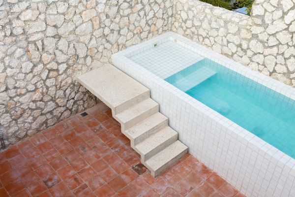 The tiles for the pool echo the ones used in the bathroom and kitchen. 