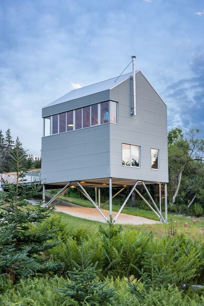 Perched on stilts over sloping terrain, the 1,050-square-foot Skybox draws from fishing shack vernacular.