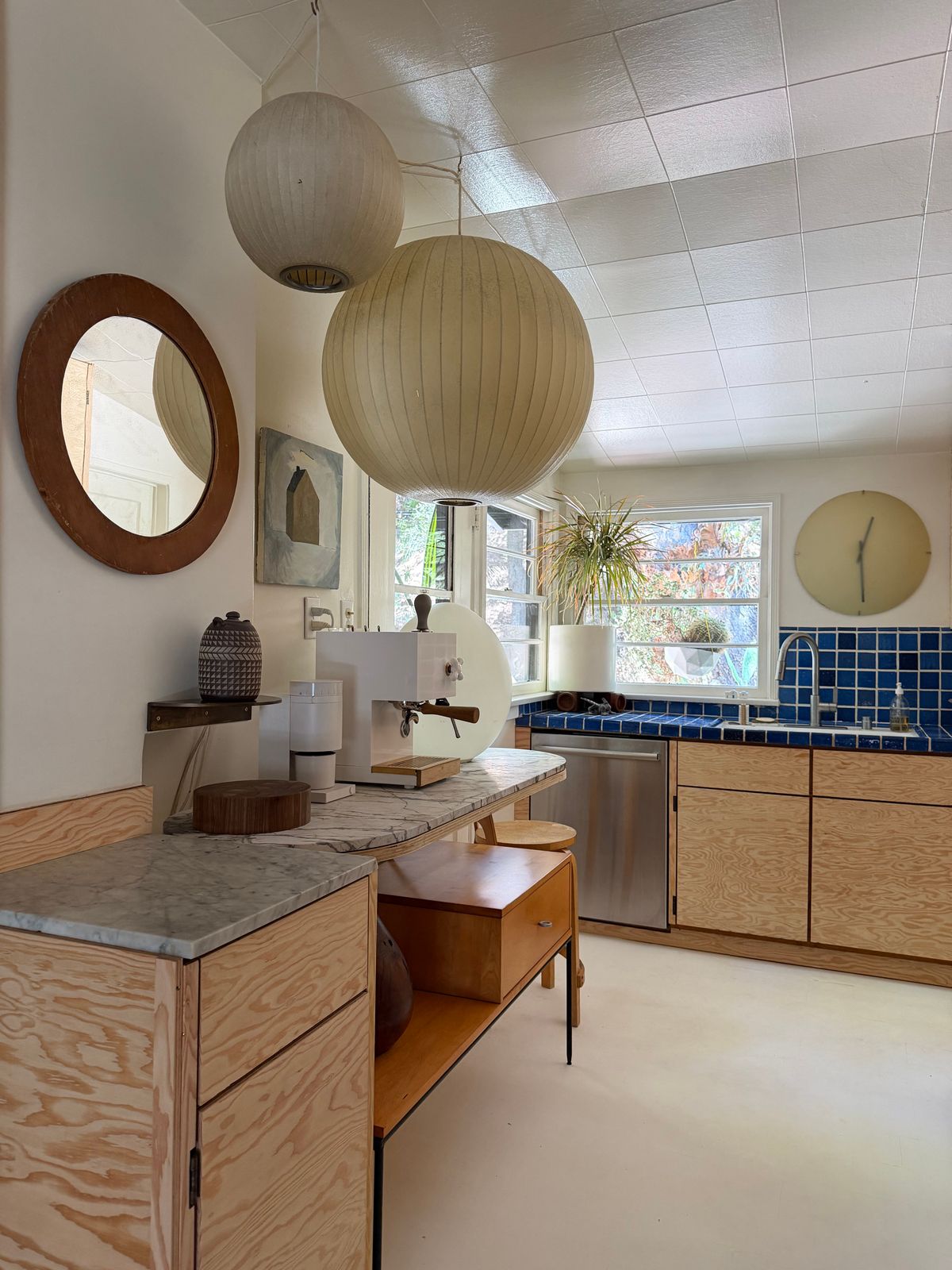 For Mason, there's no such thing as too many lamps. A collection of George Nelson bubble lamps hang above the coffee counter.