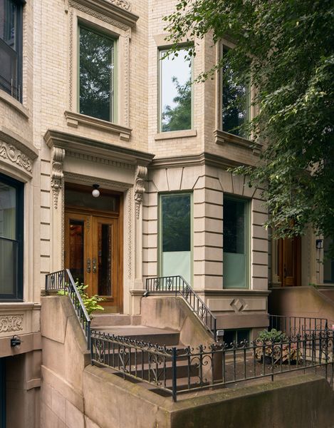 The home’s exterior fits in with the traditional Park Slope streetscape. New Marvin windows with green frames hint at the colorful interior.