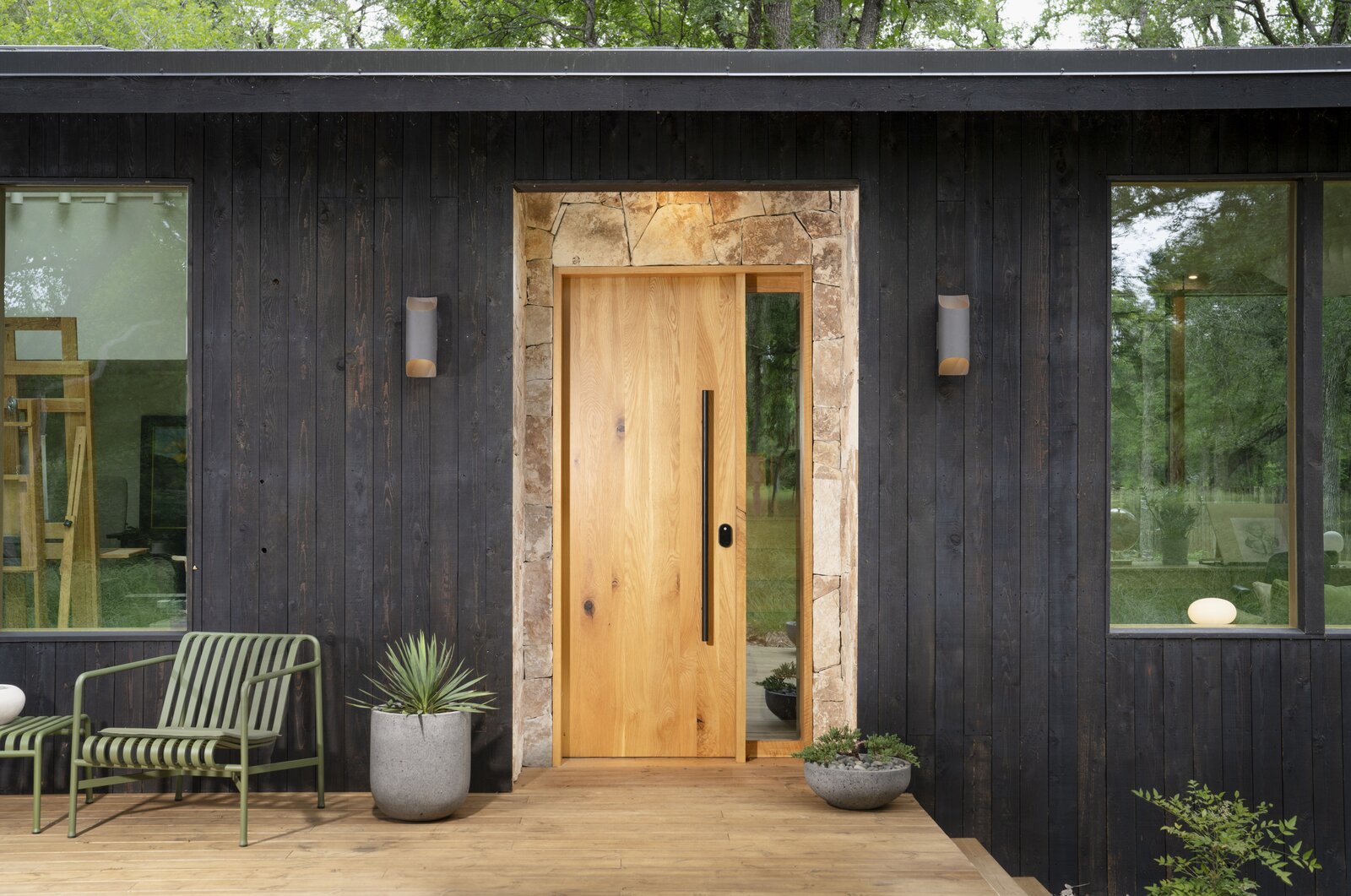 The studio uses Shou Sugi Ban cedar siding, white oak, and local Texas limestone. 