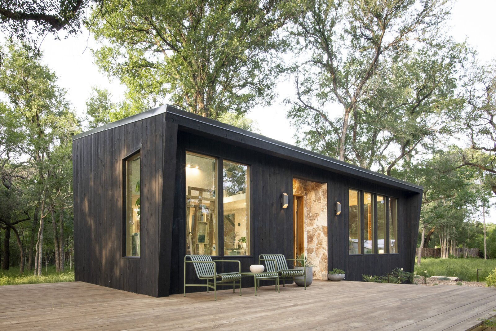 Outdoor lounge chairs from Design Within Reach rest on the floating wood deck. 