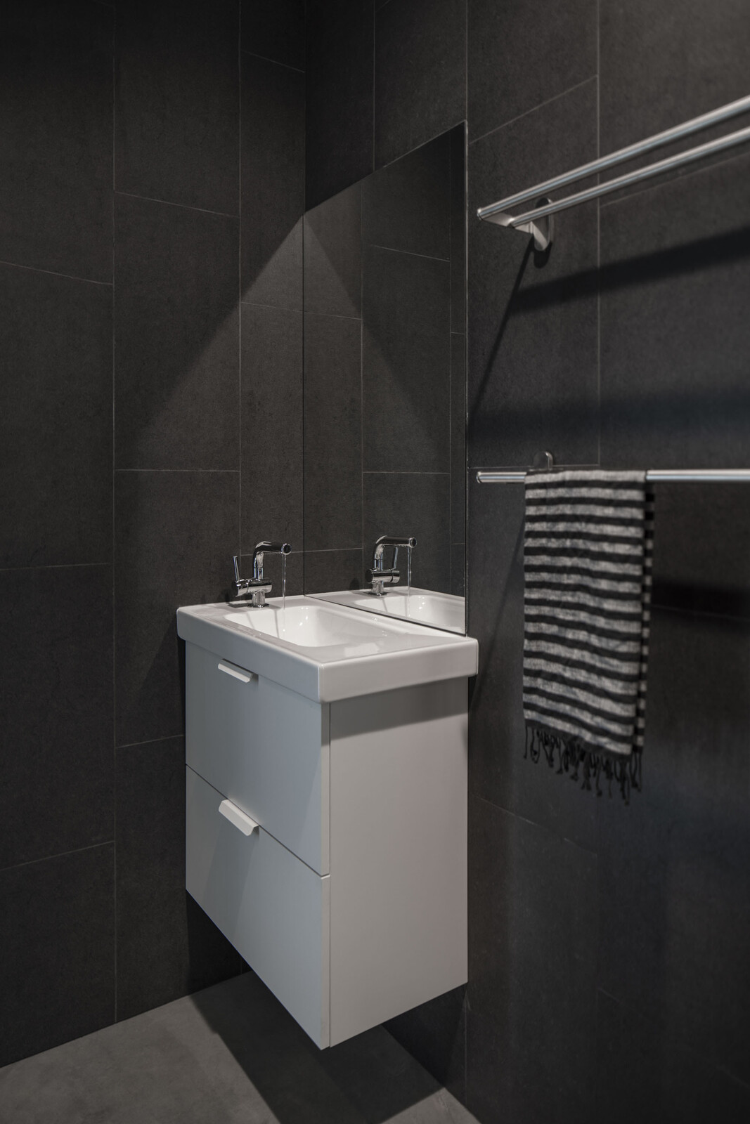 In line with the design intent to keep the space as healthy and eco-friendly as possible, the bathroom tiles from TK are certified by the Greenguard Environmental Institute, a nonprofit that promotes indoor air quality.