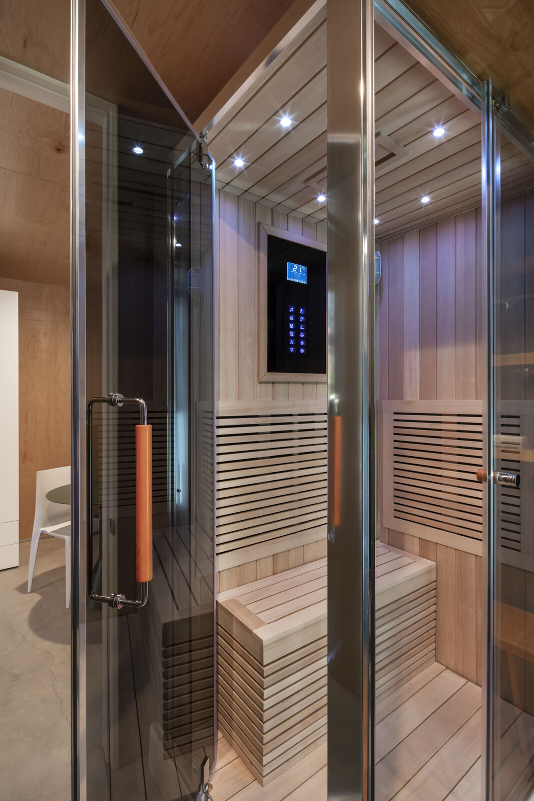 While the couple splurged on Michael's dream steam shower and sauna from Aquapeutics, they saved elsewhere by opting for Ikea cabinets and Caesarstone countertops in the kitchenette.