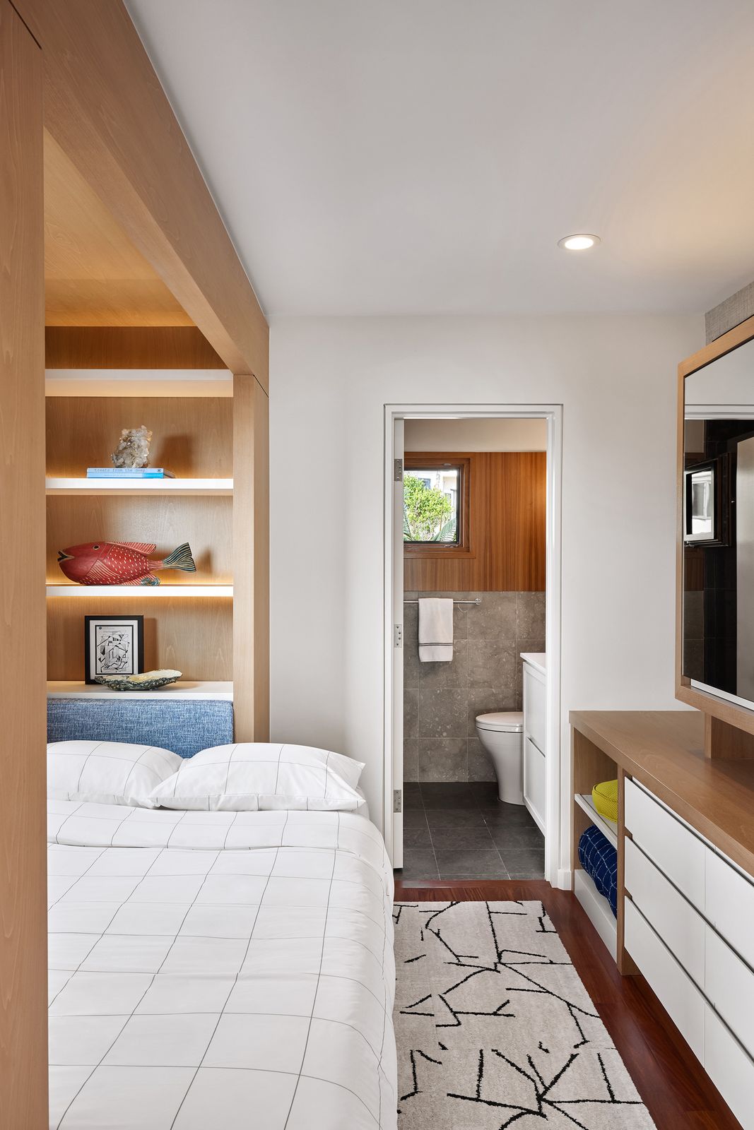 Built-in millwork with integrated lighting add extra storage.