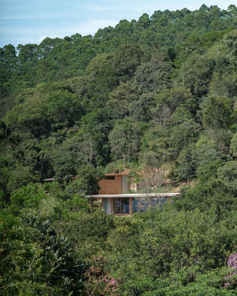 Arquipélago Arquitetos designed three modular rammed earth homes in Piracaia, a village about two hours from São Paulo.