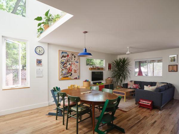 The double-height stair volume and new windows create a much sunnier, open, and functional home.