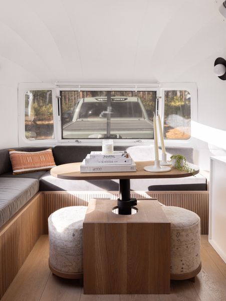 The renovation added a custom coffee table that transform into a dining table.